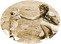  Joy Adamson & Elsa  -  Elsa the lioness was raised by Joy Adamson and was returned to the African wilderness.  
